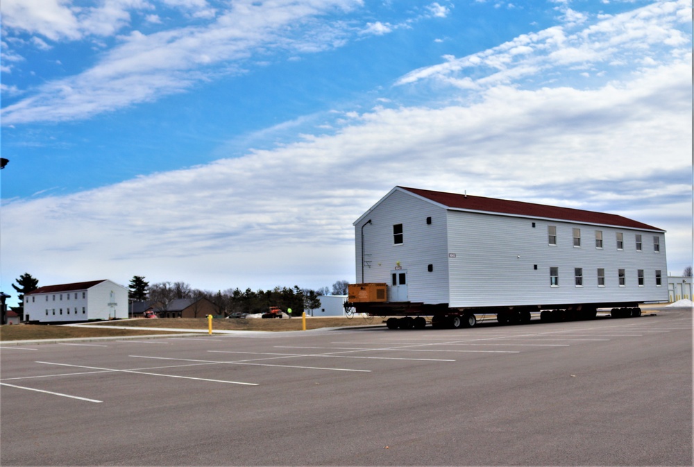 Contractors move third World War II-era barracks to new location