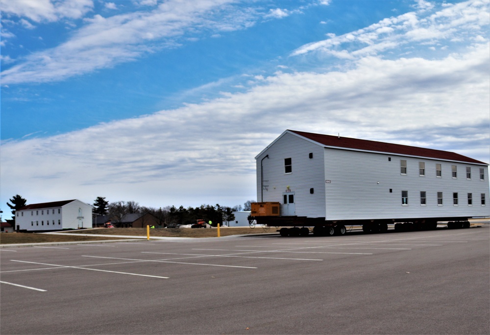 Contractors move third World War II-era barracks to new location