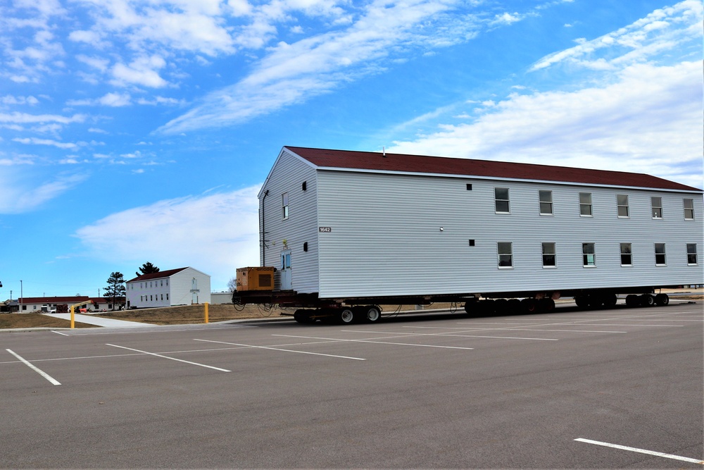 Contractors move third World War II-era barracks to new location