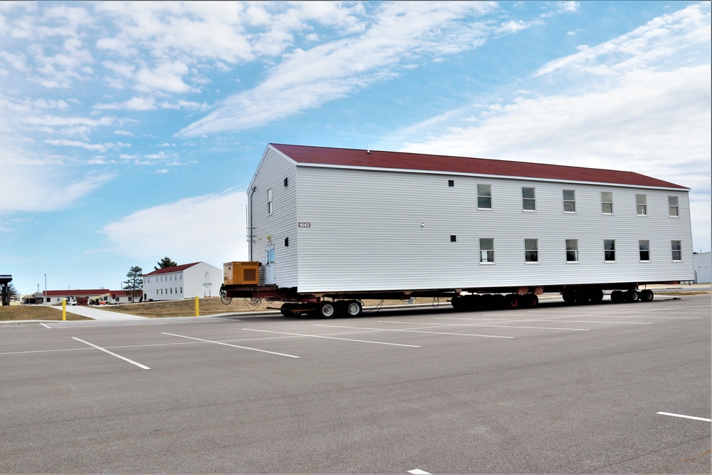 Contractors move third World War II-era barracks to new location