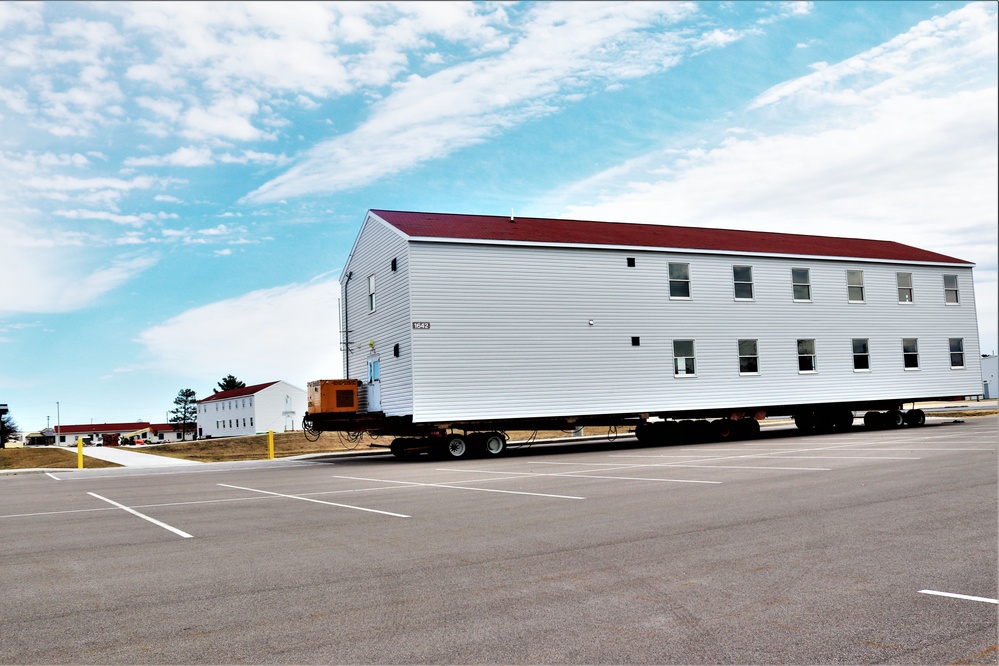 Contractors move third World War II-era barracks to new location