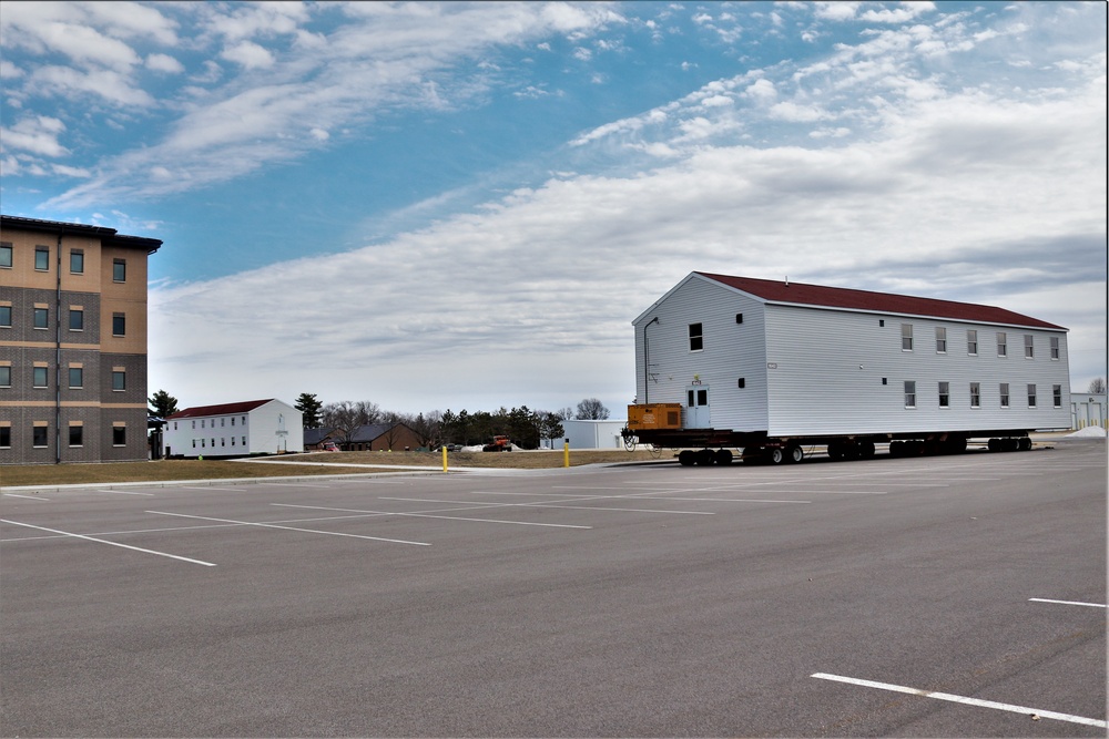 Contractors move third World War II-era barracks to new location