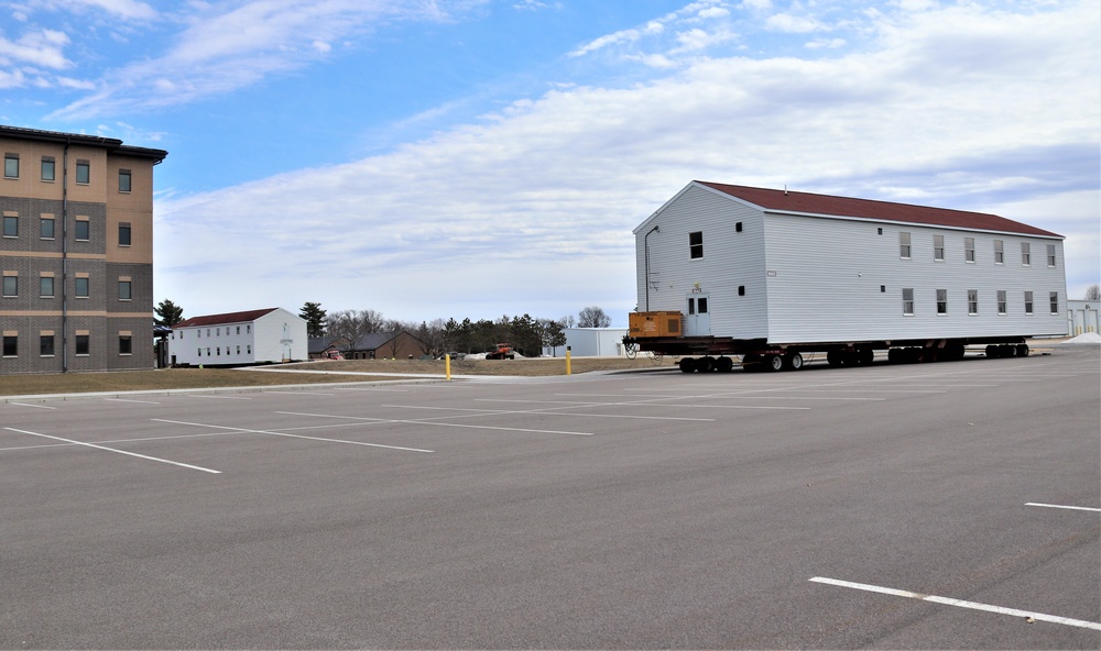 Contractors move third World War II-era barracks to new location