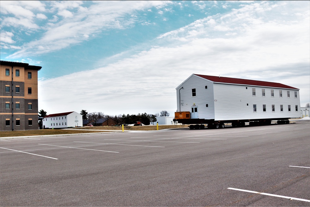 Contractors move third World War II-era barracks to new location