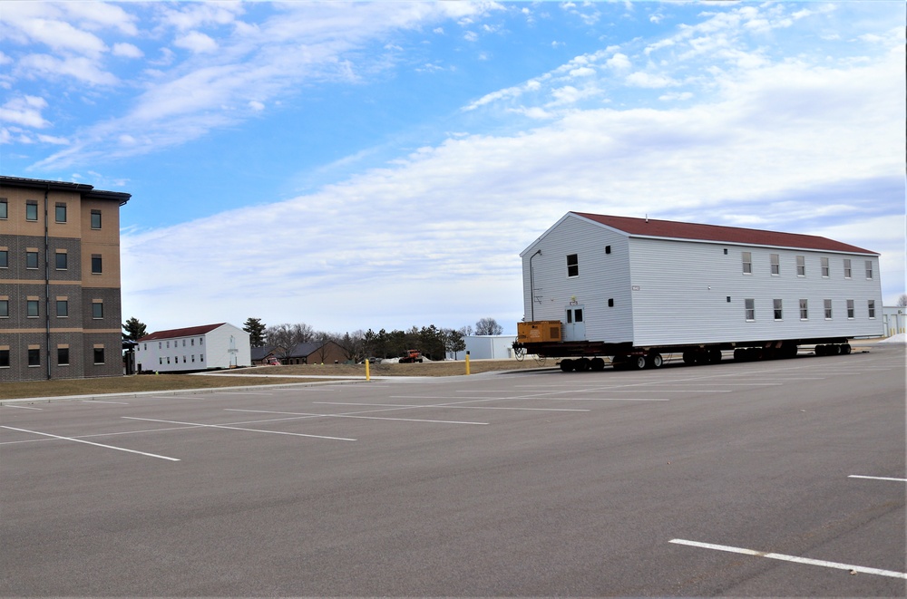 Contractors move third World War II-era barracks to new location