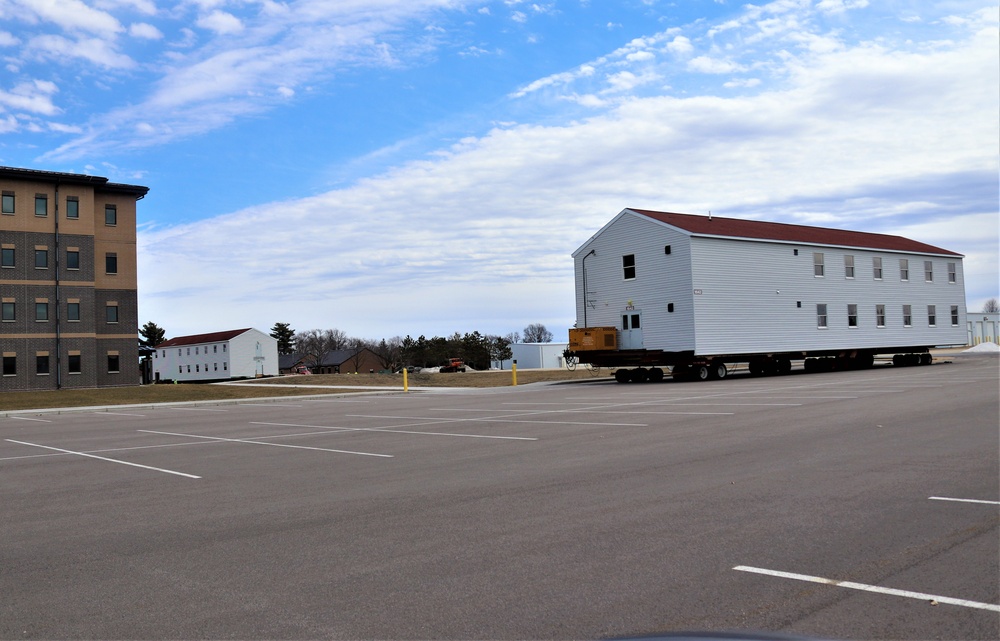 Contractors move third World War II-era barracks to new location