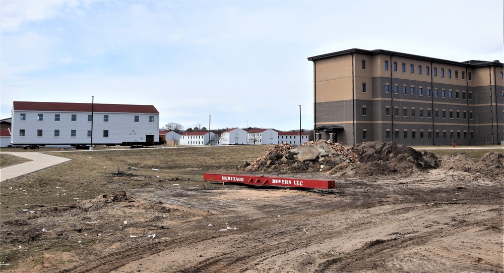 Contractors move third World War II-era barracks to new location