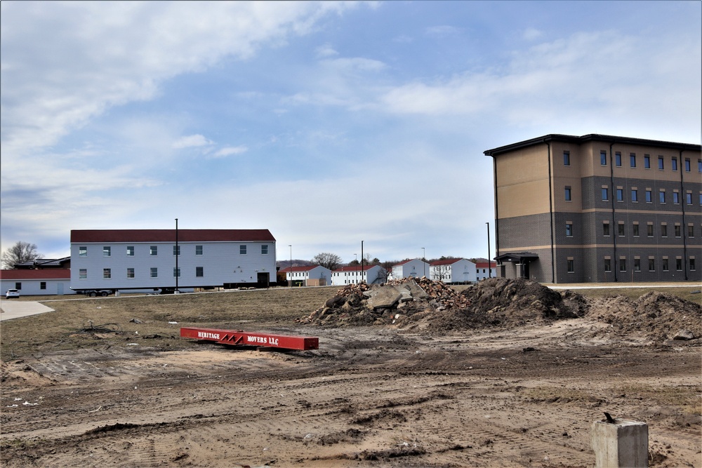 Contractors move third World War II-era barracks to new location