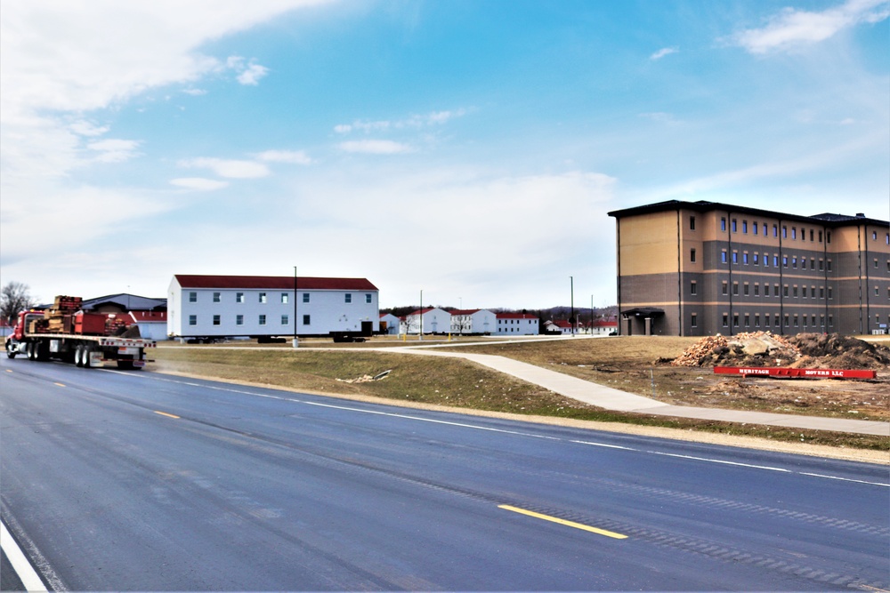 Contractors move third World War II-era barracks to new location