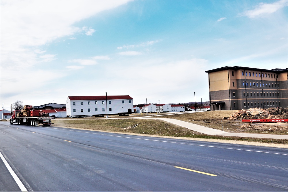 Contractors move third World War II-era barracks to new location