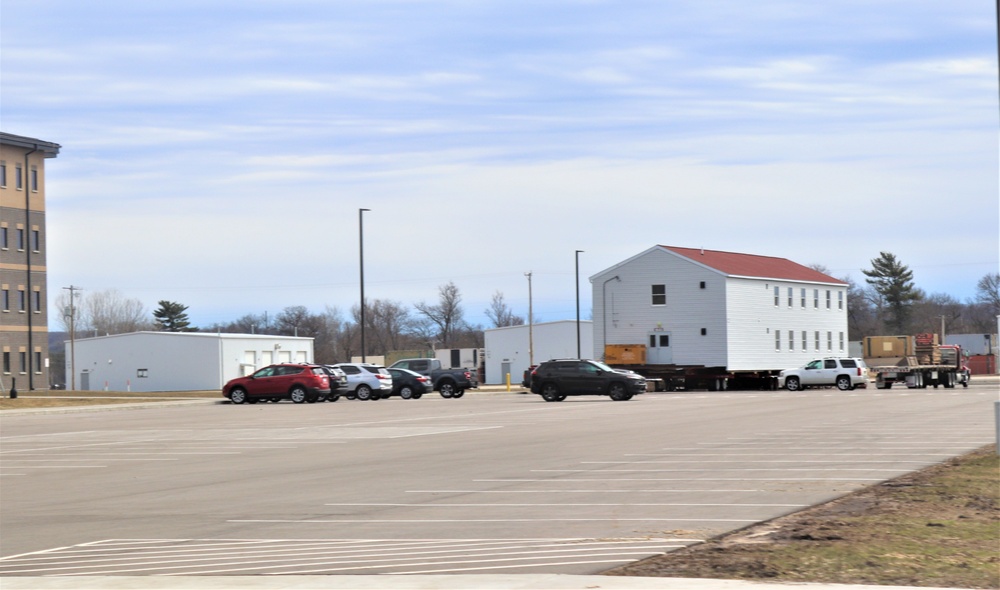 Contractors move third World War II-era barracks to new location