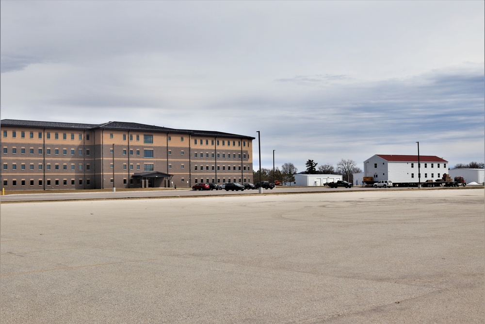 Contractors move third World War II-era barracks to new location