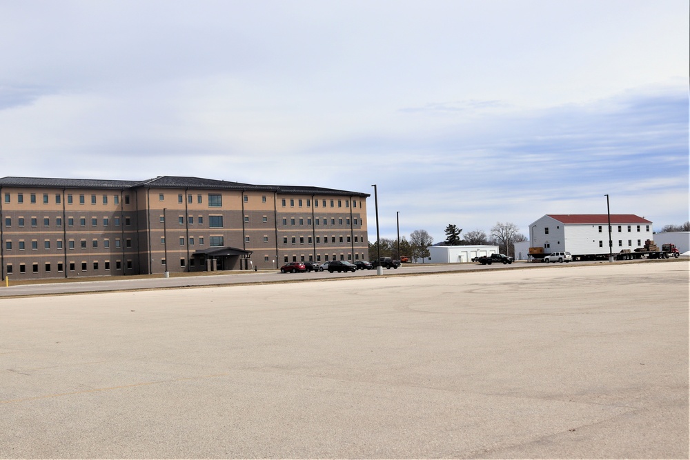 Contractors move third World War II-era barracks to new location