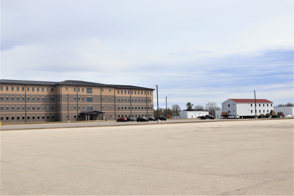 Contractors move third World War II-era barracks to new location