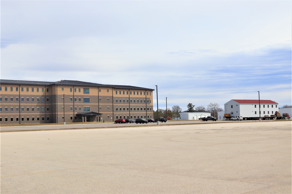 Contractors move third World War II-era barracks to new location