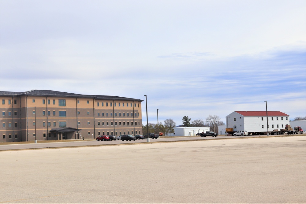 Contractors move third World War II-era barracks to new location