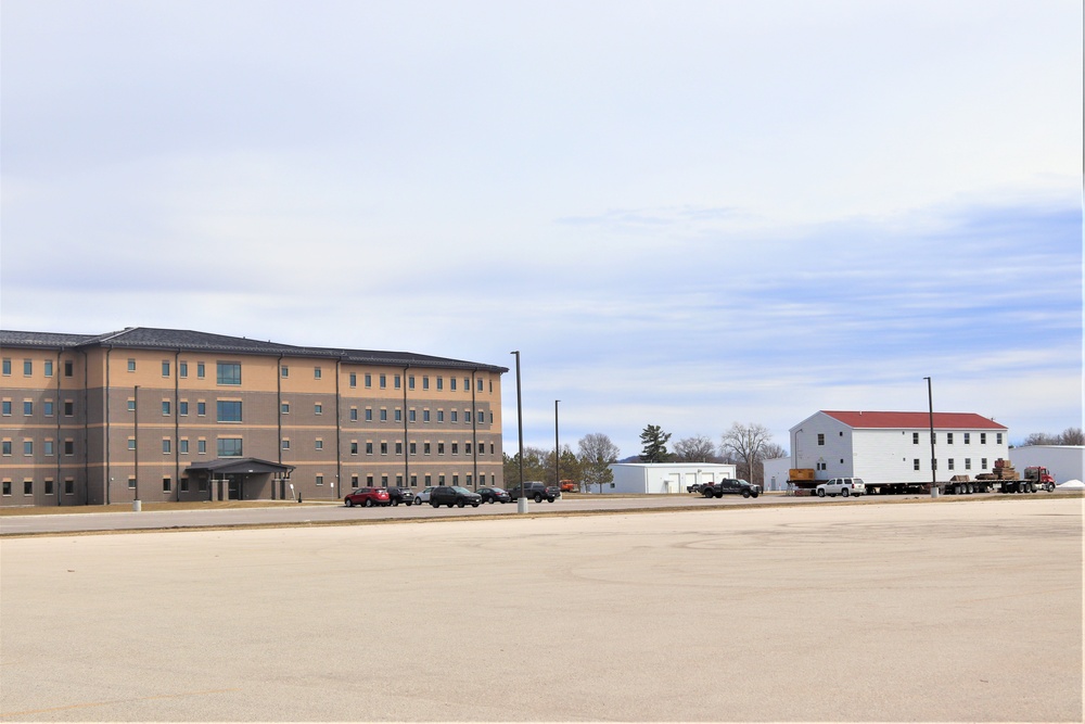 Contractors move third World War II-era barracks to new location