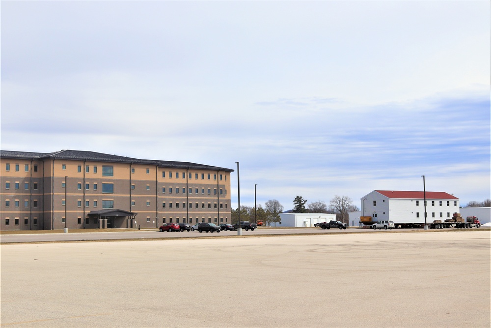 Contractors move third World War II-era barracks to new location