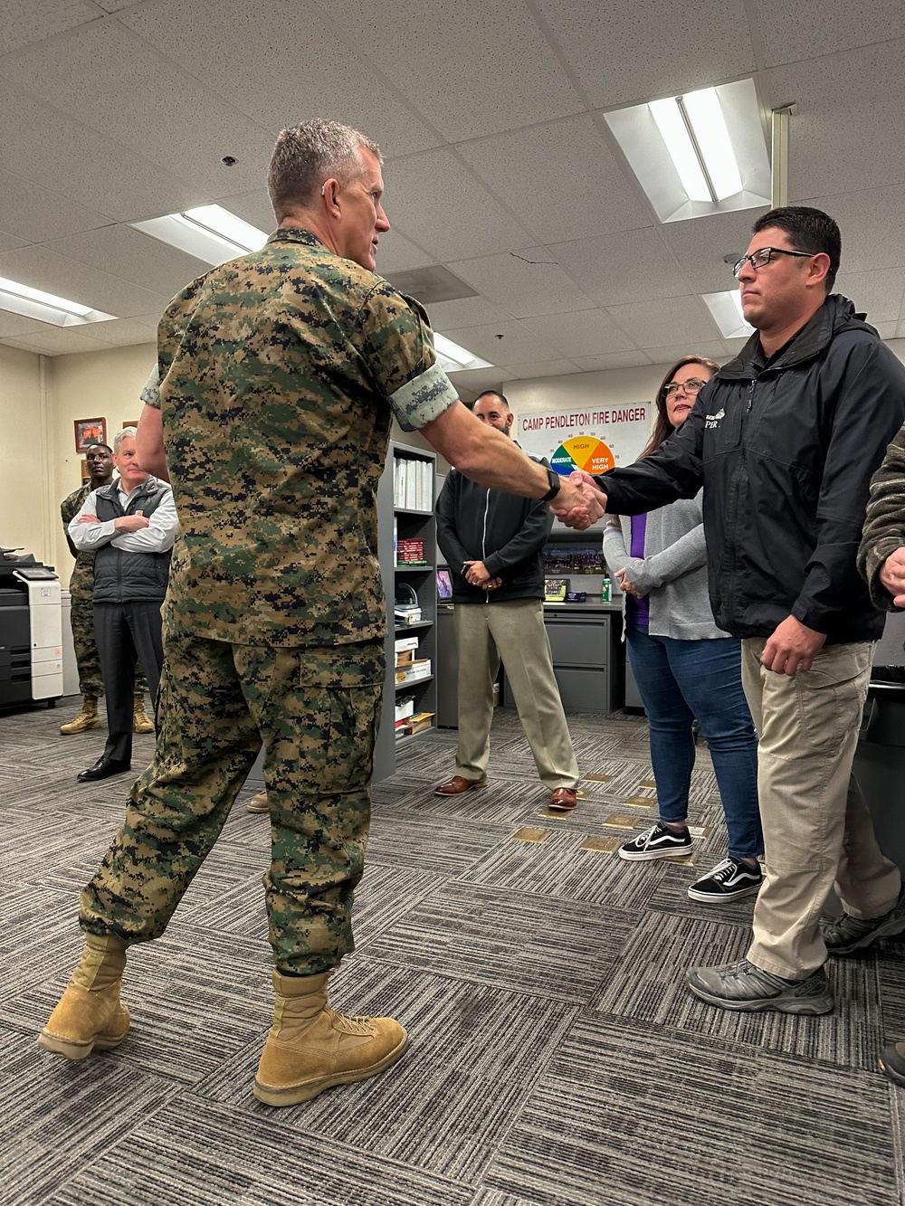 CG presents coins to Range Safety staff