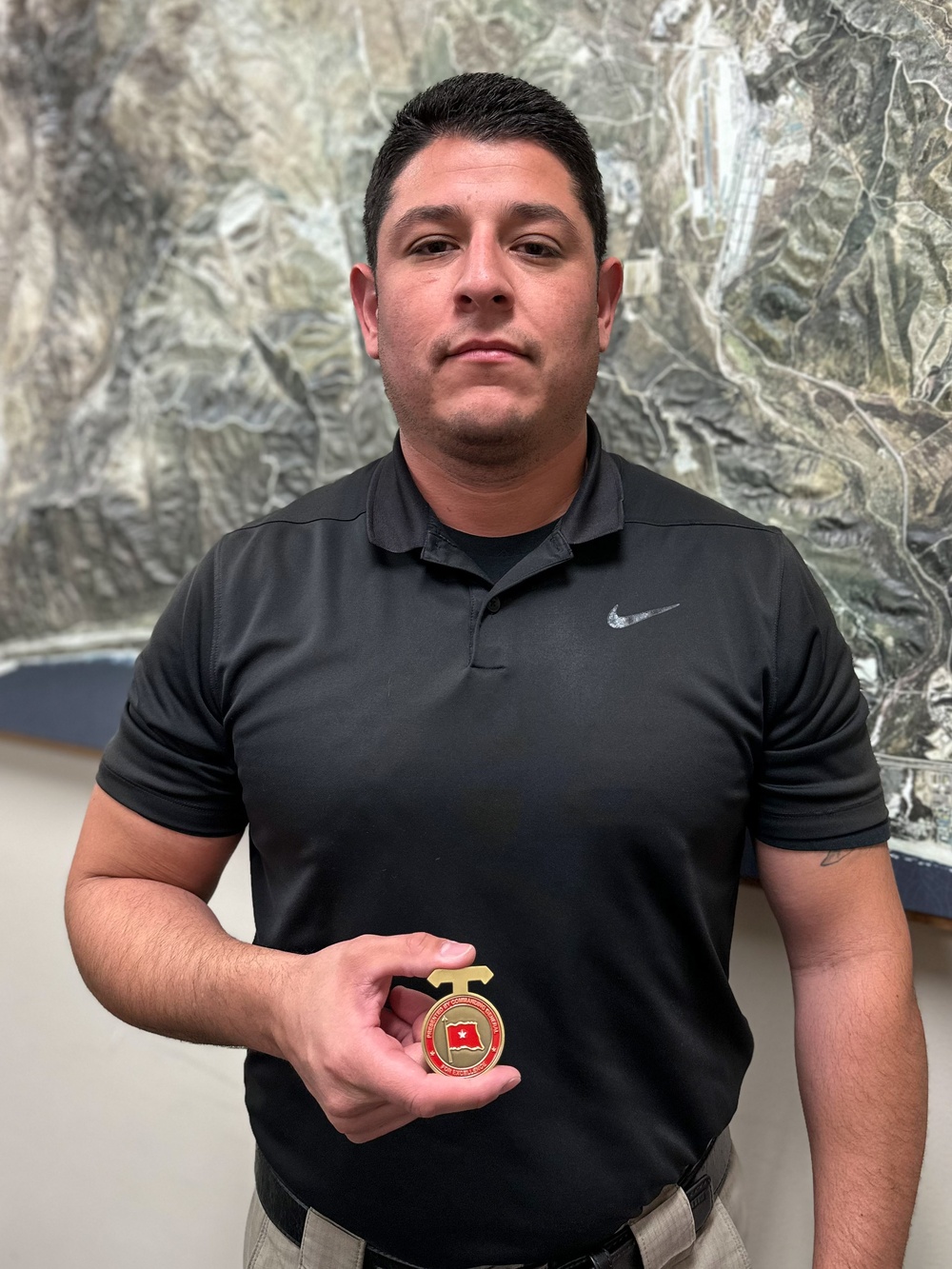 CG presents coins to Range Safety staff