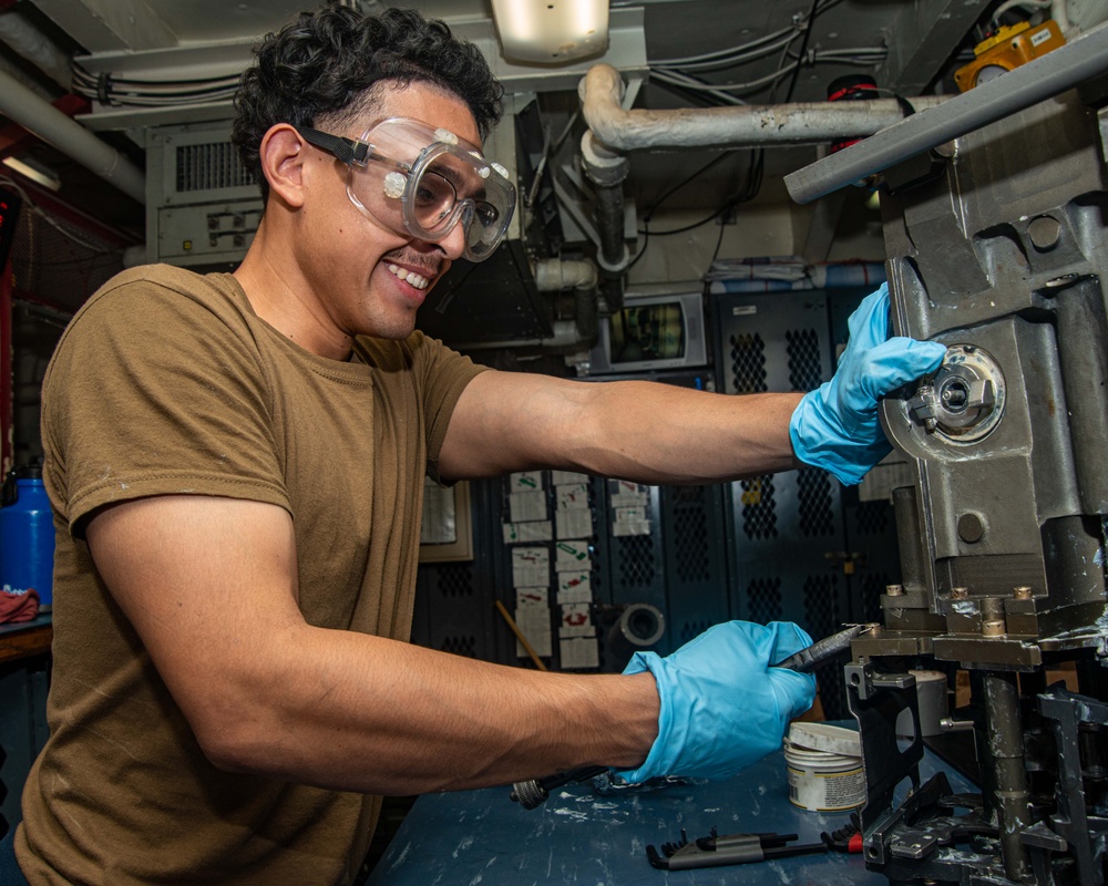 Sailor Attaches Lock Wire To Feeder Assembly