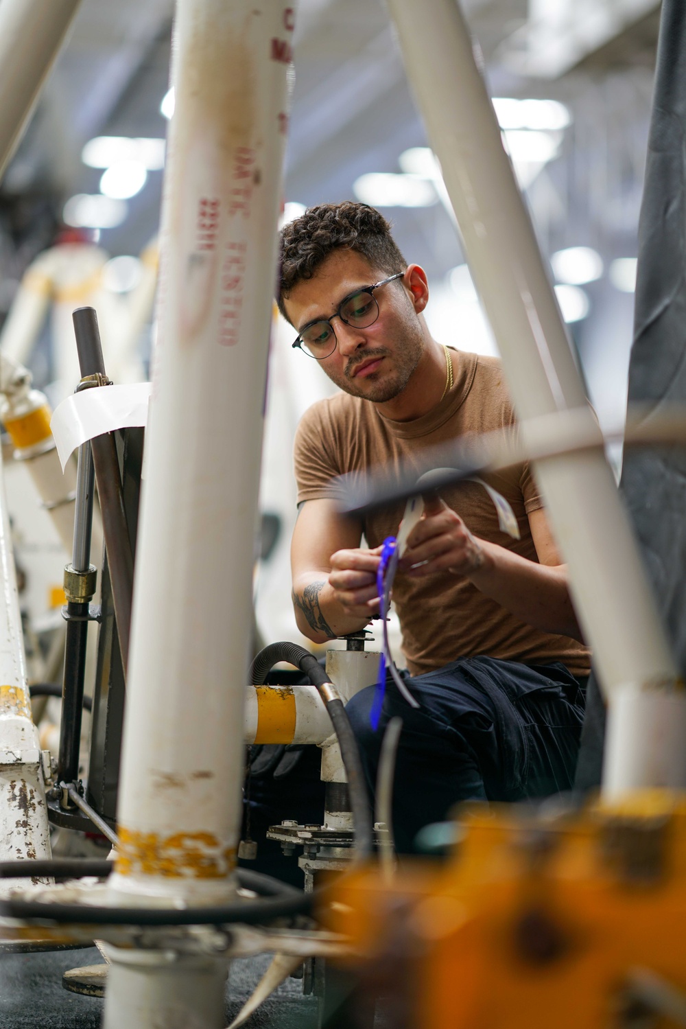 Sailor preforms maintenance aboard USS Carl Vinson