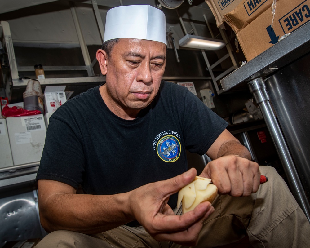 Senior Chief Carves Potatoes Into Display Garnishes