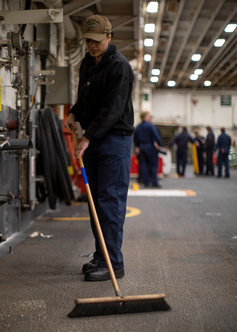 USS BATAAN Sailor Cleans