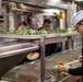 USS BATAAN Sailor serves lunch