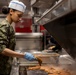 USS BATAAN Sailor prepares lunch