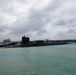 The Ohio-class guided-missile submarine USS Michigan (SSGN 727) departs Guam, March 1.