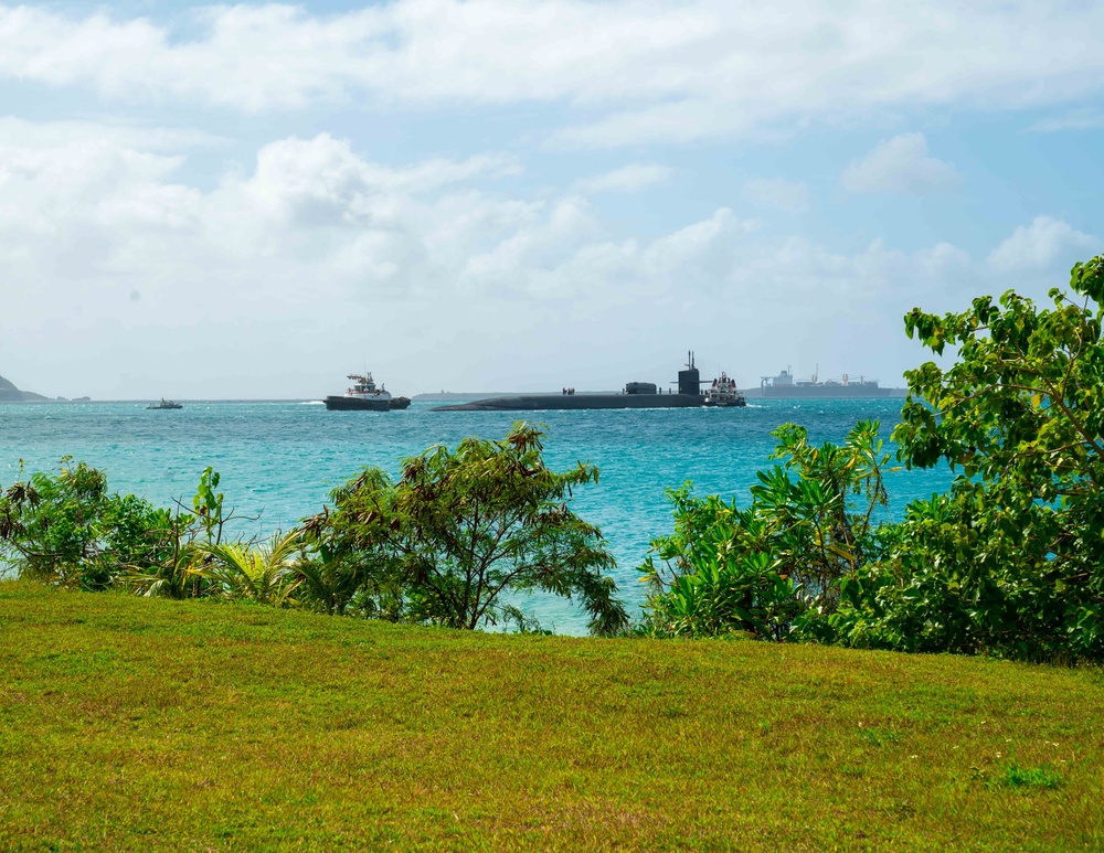 The Ohio-class guided-missile submarine USS Michigan (SSGN 727) departs Guam, March 1.
