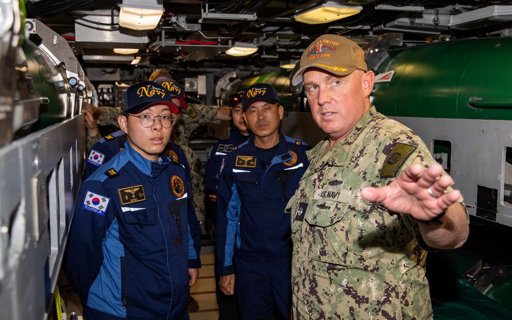 U.S. Navy Cmdr. Daniel McNab, commanding officer of the Virginia-class fast-attack submarine USS Illinois (SSN 786) leads a tour from the Republic of Korea Navy during exercise Sea Dragon 2023, March 21.