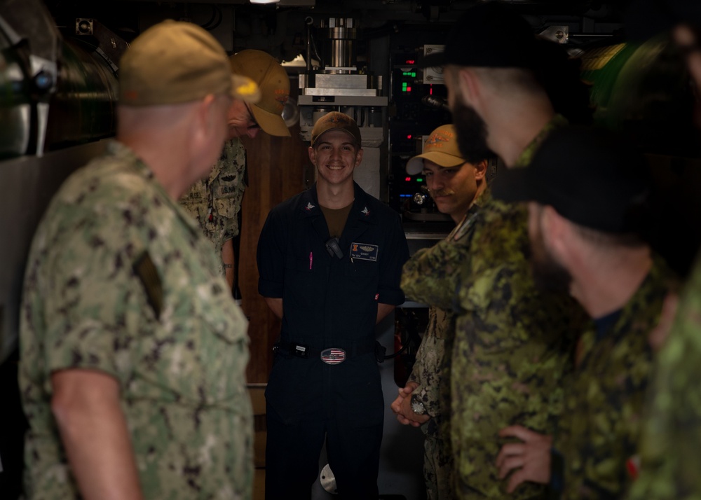 Members of the Canadian Armed Forces tour the Virginia-class fast-attack submarine USS Illinois (SSN 786) during  exercise Sea Dragon 2023, March 21.