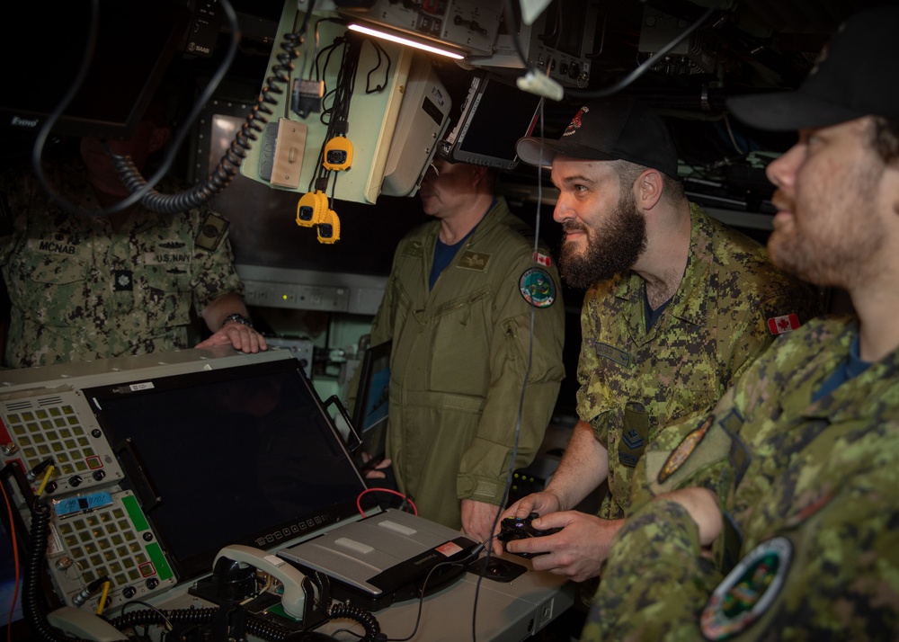 Members of the Canadian Armed Forces tour the Virginia-class fast-attack submarine USS Illinois (SSN 786) during exercise Sea Dragon 2023, March 21.