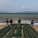 Marines and Sailors offload equipment from INLS vessels during Balikatan 23