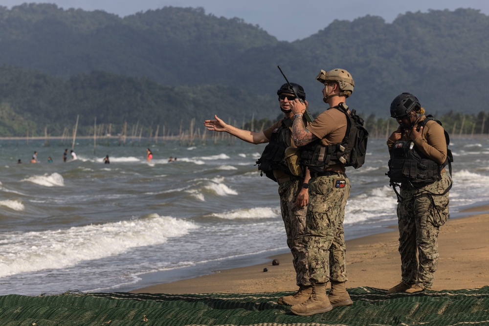 Marines and Sailors offload equipment from INLS vessels during Balikatan 23