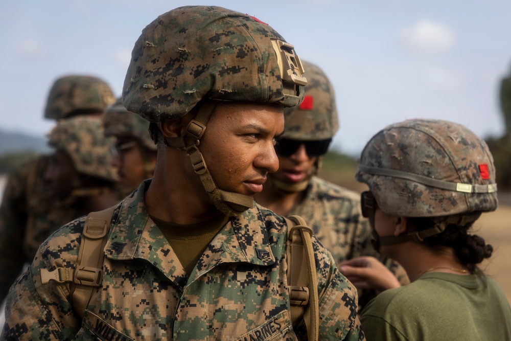 Marines and Sailors offload equipment from INLS vessels for CJLOTS