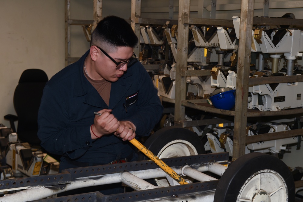 USS Ronald Reagan (CVN 76) Sailors assemble a munitions handling unit