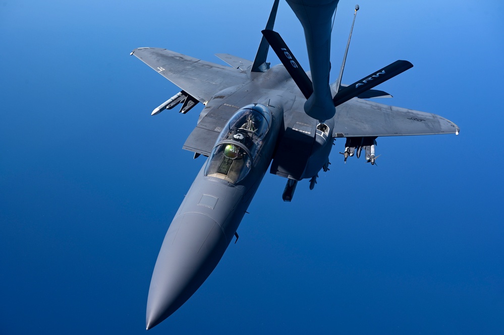 KC-135 Stratotanker refuels F-15E Strike Eagles