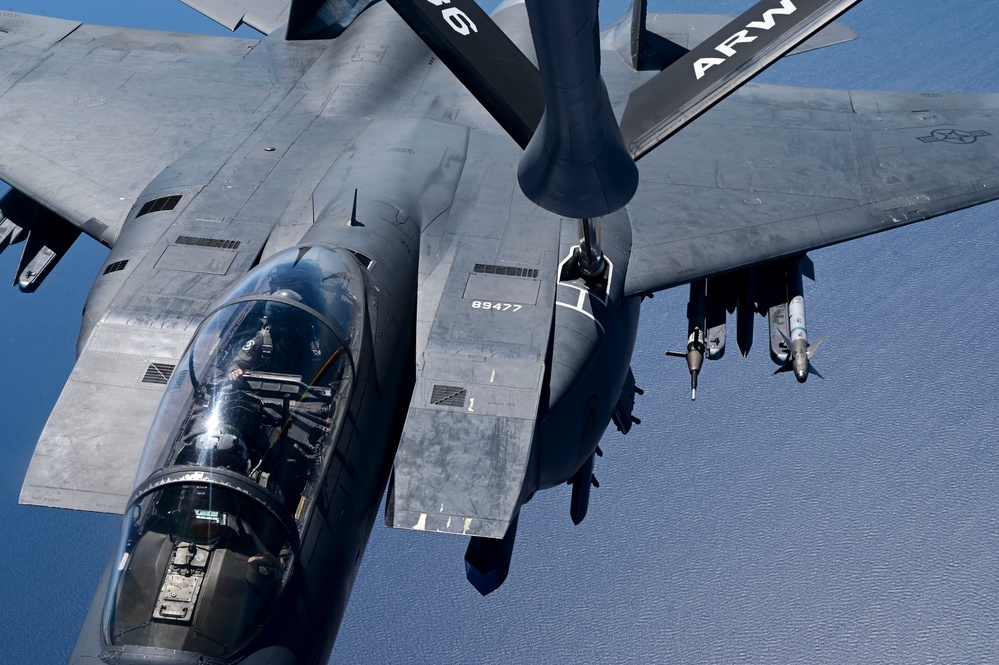 KC-135 Stratotanker refuels F-15E Strike Eagles