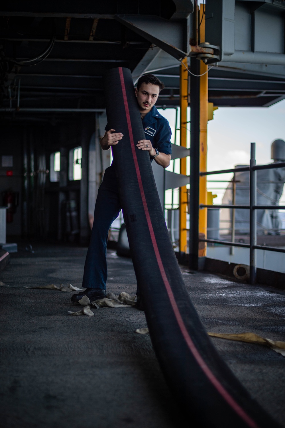 Sailors Work on the Fantail of USS Carl Vinson (CVN70)