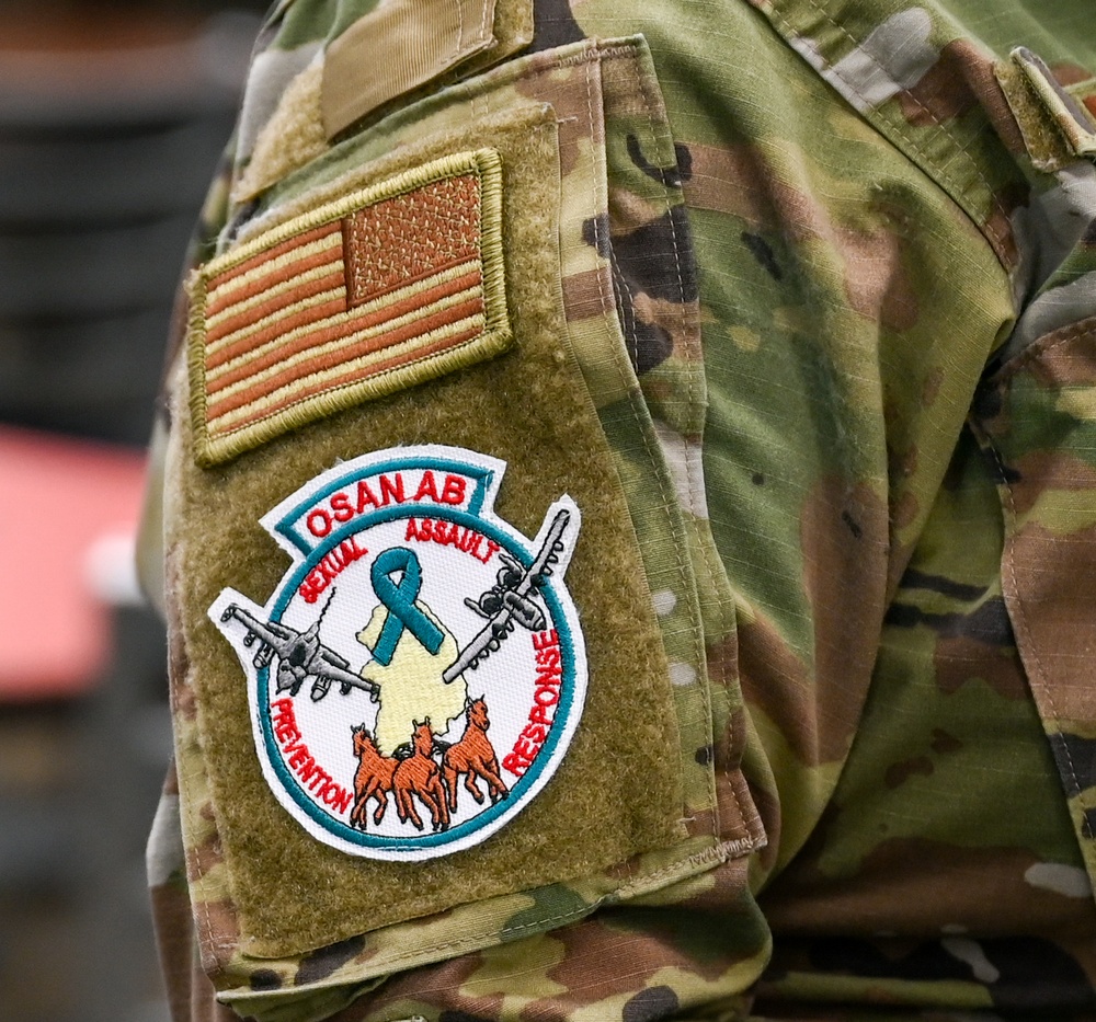 Team Osan supporters wear patches to support SAAPM