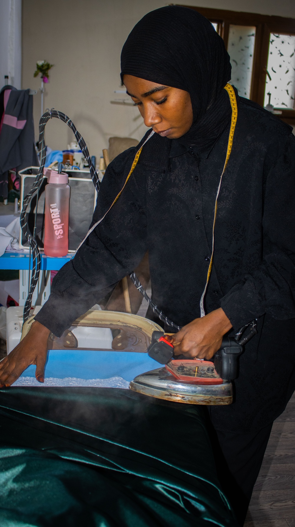 Aisha is a fashion designer who runs her own small business in Sebha, Libya