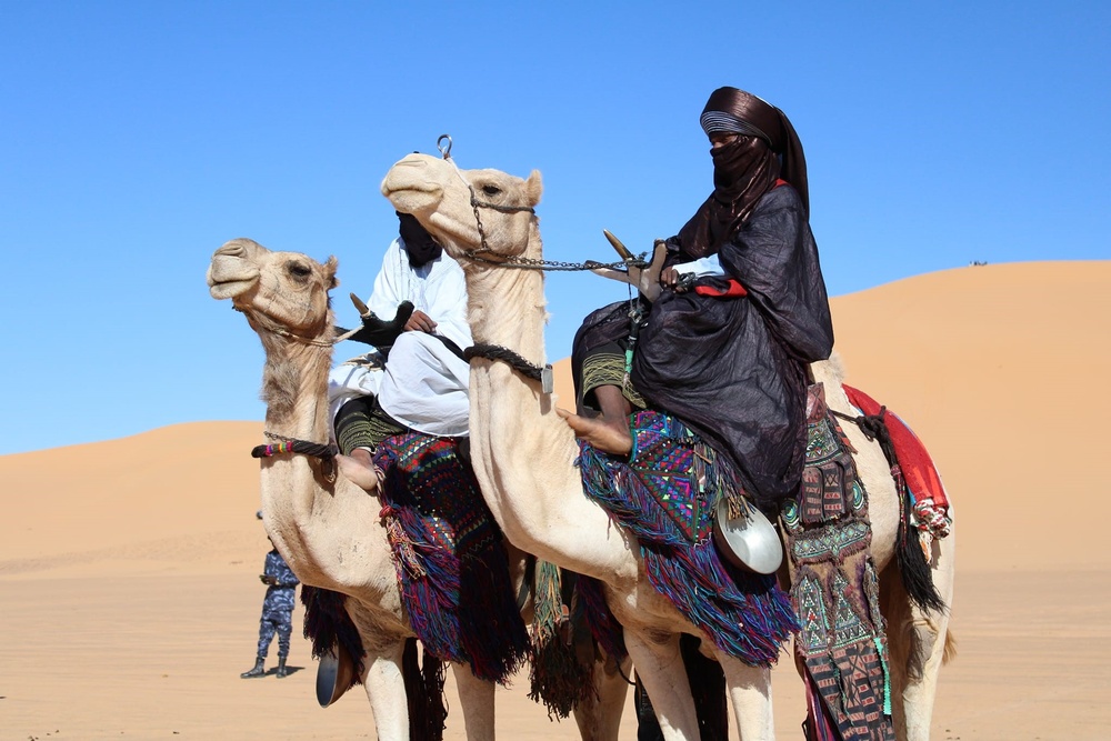 Local tribes ride their camels into the Ghat cultural festival