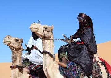 Local tribes ride their camels into the Ghat cultural festival