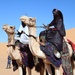 Local tribes ride their camels into the Ghat cultural festival