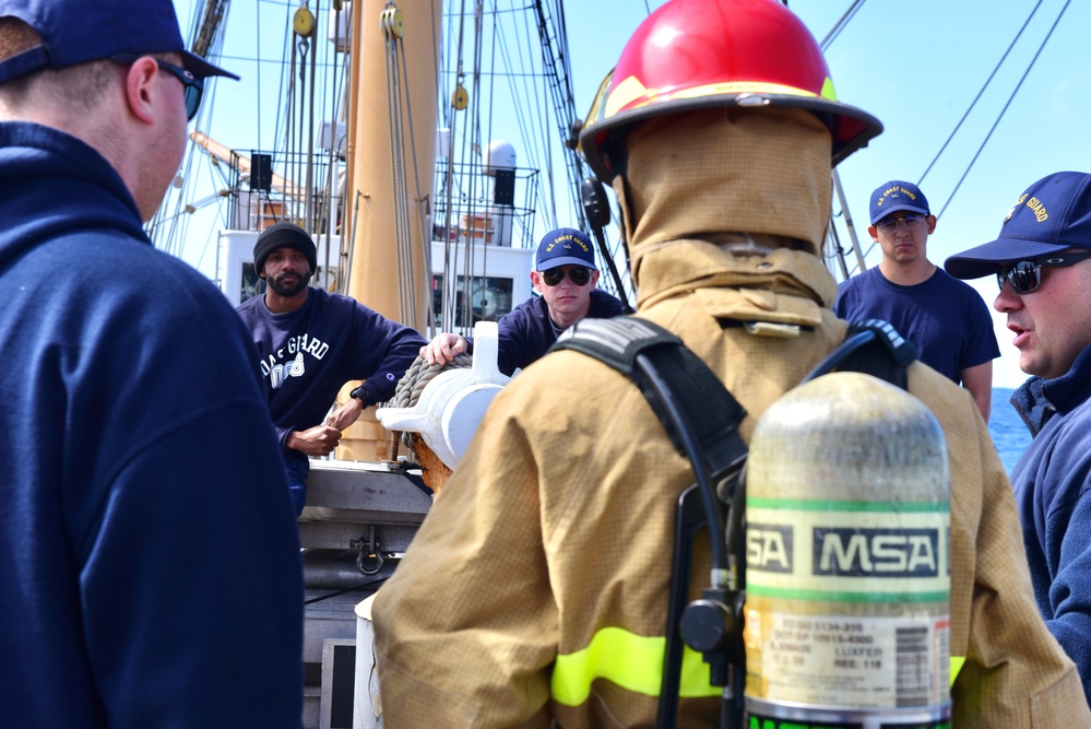Coast Guard, National Oceanic and Atmospheric Administration officer candidates and embarked foreign military personnel receive firefighting training aboard USCGC Eagle while underway in the Atlantic Ocean