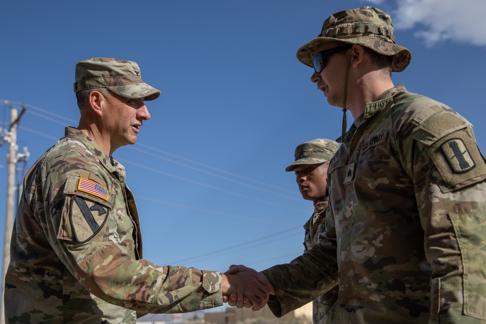 197th Field Artillery Brigade Commander awards soldiers from the 3-197th FAR