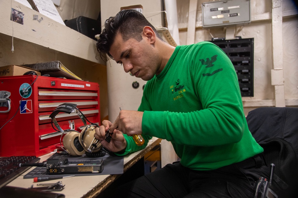 U.S. Navy Sailor Repairs Microphone